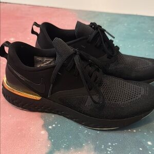 Nike women’s odyssey react flyknit like new running Black and Gold Sneakers 7